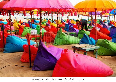 Indonesia, Bali island, Beach in Kuta - October 01, 2017: Сafe worker is preparing to open a restaur