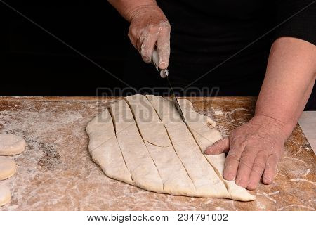The Cook Slicers Raw Dough With A Knife On A Narrow Line 2018