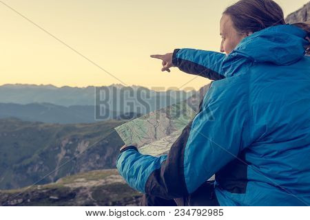Female Hiker Showing The Way. Exploring Brenta Dolomites, Italy.