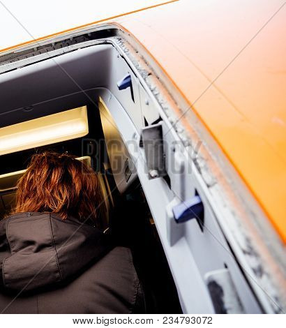 Hamburg, Germany - Mar 22, 2018: Rear View Of Passengers Entering Easyjet Airplane Early In The Morn