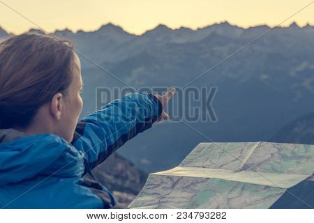 Female Hiker Showing The Way. Exploring Brenta Dolomites, Italy.