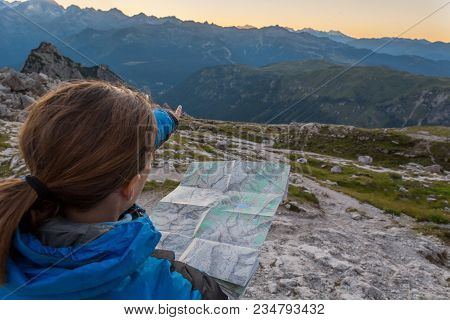 Female Hiker Showing The Way. Exploring Brenta Dolomites, Italy.
