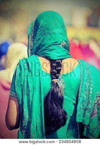 Indian Woman With Green Dress And Long Black Hair With Vintage Effect