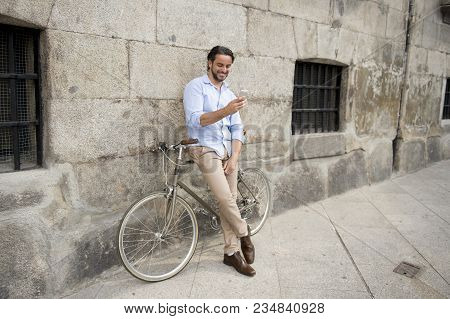 Young Happy Attractive Hispanic Man In Casual Trendy Clothes Smiling Cheerful Using Mobile Phone On 
