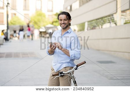 Young Happy Attractive Hispanic Man In Casual Trendy Clothes Smiling Cheerful Using Mobile Phone On 