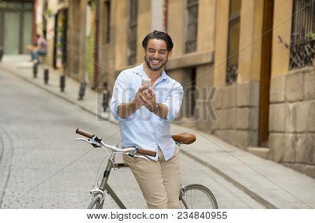 Young Happy Attractive Hispanic Man In Casual Trendy Clothes Smiling Cheerful Using Mobile Phone On 