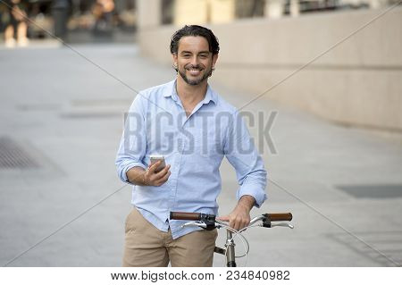 Young Happy Attractive Hispanic Man In Casual Trendy Clothes Smiling Cheerful Using Mobile Phone On 