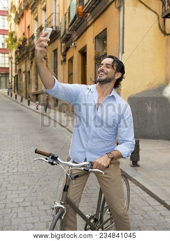 Young Happy Attractive Hispanic Man In Casual Trendy Clothes Smiling Cheerful Using Mobile Phone On 