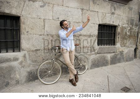 Young Happy Attractive Hispanic Man In Casual Trendy Clothes Smiling Cheerful Using Mobile Phone On 