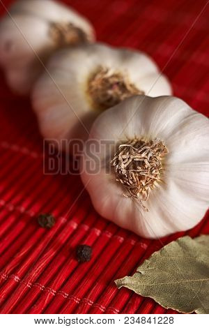 Garlic, Onion, Bay Leaf, Black Pepper On A Wooden Table. Garlics. Sliced Garlic, Garlic Clove, Garli