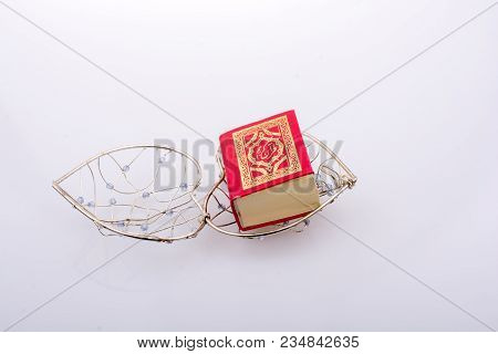 The Holy Quran In Mini Size In A Heart Shaped Cage