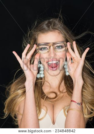 Sexy Girl With Makeup And Big Earrings, Dark Background. Optics Store Concept. Girl Short Sightednes