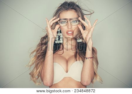 Optics Shop Concept. Woman With Big Breasts Wears Old Fashioned Eyeglasses For Vision. Sexy Nude Gir