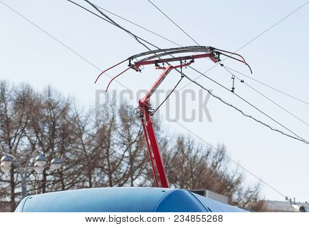Tram Wires Against The Blue Sky In The City