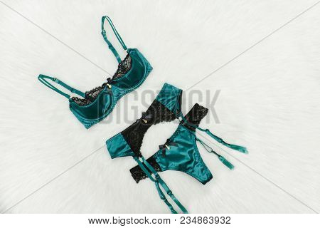 Emerald Set Of Underwear On White Fur. Fashion Background
