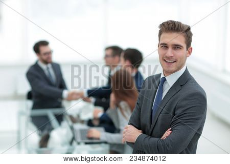 Business partners shaking hands over business objects on workpla