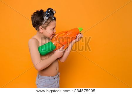 Give Yourself Enough Time To Play! Curious Smiling Pisser Shooting With A Help Of Water Gun And Spen
