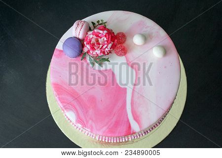Tasty Pink Homemade Cake Decorated By Rose And Macarons. Marbelous Effect On Cake