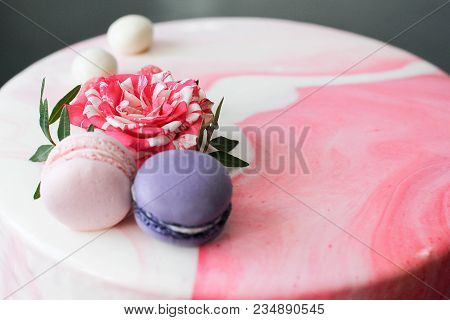 Tasty Pink Homemade Cake Decorated By Rose And Macarons. Marbelous Effect On Cake