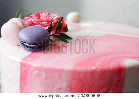 Tasty Pink Homemade Cake Decorated By Rose And Macarons. Marbelous Effect On Cake