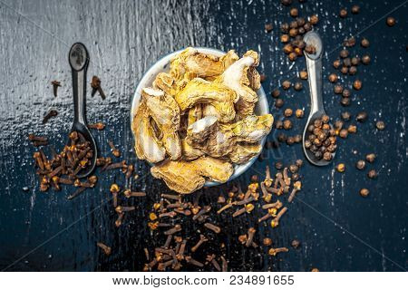 Close Up Of Ayurvedic Herb Or Folk Medicine Dried Ginger Or Zingiber Officinale With Black Pepper Co
