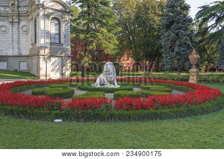 Istanbul, Turkey - September 13, 2017: This Is A Flower Bed With A Sculpture Of A Lion In The Dolmab