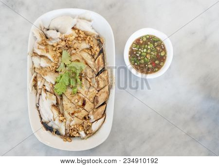 Singaporean Hainanese Signature Chicken Rice Served On A Long Plate