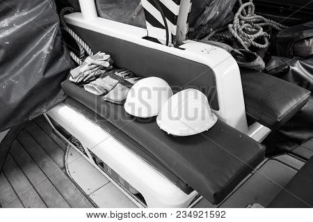 Gloves And Helmets On Grey Seat Background In Boca De Valeria, Brazil. Construction, Industry, Profe