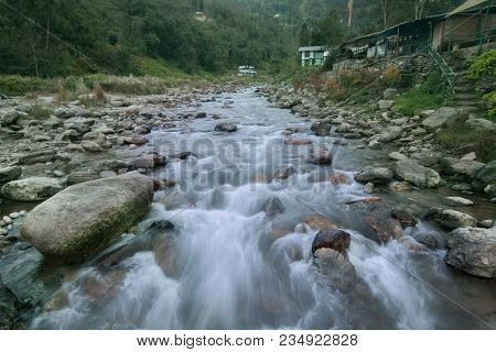Beautiful Reshi River Water Flowing Through Stones And Rocks At Dawn, Sikkim, India. Reshi Is One Of
