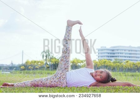 Healthy Yoga Girls And Concentrate In The Park , Kid Yoga Practice For Health In The Nice Day , Yoga