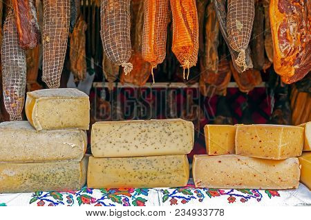 Various Types Of Romanian Chesses And Sausages, Smoked And Dried, Exposed For Sale At One Traditiona