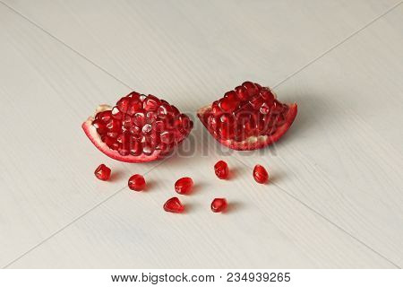 Big Ripe Red Granets Or Garnets. Fruits Of Red Ripe Pomegranate On The White Background. Vegetarian 