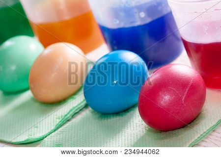 Staining With Food Colors Of Easter Eggs Watercolor Background With Colorful Rainbow Easter Eggs.