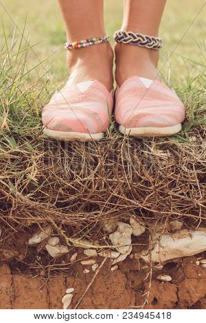 Detail Of A Young Woman's Shoes And Anklet Outdoors.