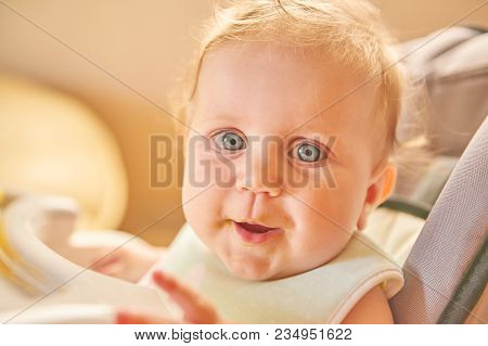 Portrait Risible Blonde Girl With Blue Round Eyes