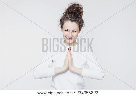 People And Lifestyle Concept. Beautiful Young Caucasian Woman With Curly Bun Hairstyles, Dressed In 