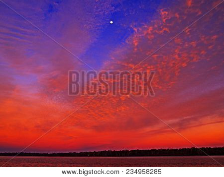 A Spectacular Inspirational Brightly Coloured Radient Crimson Cirrus Colored Coastal Sunrise Seascap