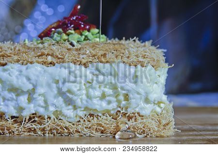 Pouring Syrup On Osmaliya, Arabic Sweets For Ramadan And Eid