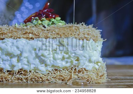 Pouring Syrup On Osmaliya, Arabic Sweets For Ramadan And Eid