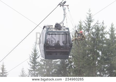 Alpinist Is Rescue People Exercise On Gondola Car