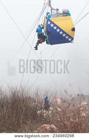 Alpinist Is Rescue People Exercise On Gondola Car