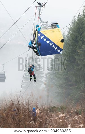 Alpinist Is Rescue People Exercise On Gondola Car