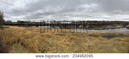 The Big Sioux River Flows Over Rocks In Sioux Falls South Dakota With Views Of Wildlife, Ruins, Park