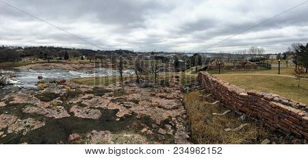 The Big Sioux River Flows Over Rocks In Sioux Falls South Dakota With Views Of Wildlife, Ruins, Park