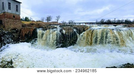 The Big Sioux River Flows Over Rocks In Sioux Falls South Dakota With Views Of Wildlife, Ruins, Park