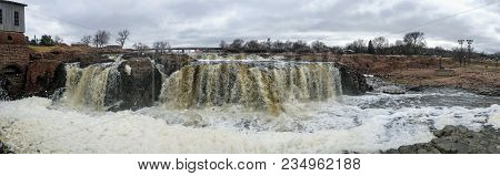 The Big Sioux River Flows Over Rocks In Sioux Falls South Dakota With Views Of Wildlife, Ruins, Park