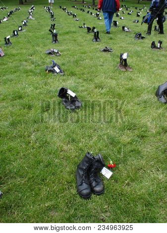 Black Boots To Remember The Fallen, Iraq War Protest Demonstration, Combat Boots Arrayed In A Grass 