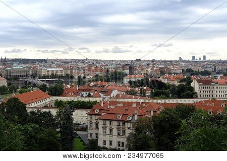 Beautiful View Of The Old Part Of The City, Houses With Red Tiles. Background