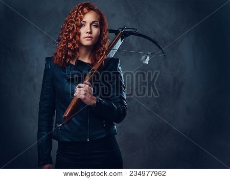 Redhead Female Dressed In An Elegant Suit Holds Crossbow.