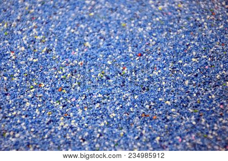 Texture Of A Colored Granular Sand Close Up. Blue Grains